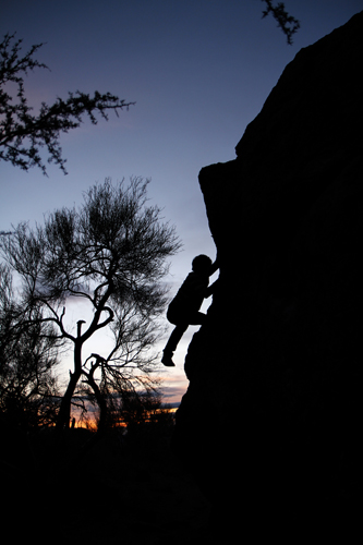 Caleb Preston boulders for the first time with a small group of friends at Gates Pass.