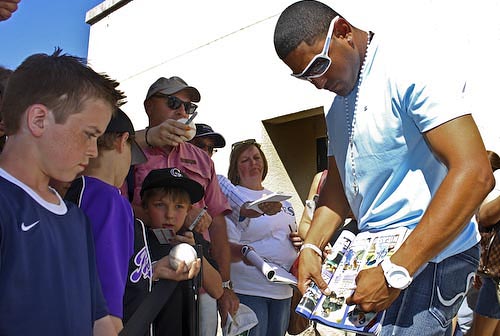 Colorado Rockies fans line up for autographs from their favorite players at the last spring training game in Tucson.