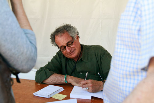 Mort Rosenblum signs copies of his book Little Bunch of Madmen: Elements of Global Reporting after the presentation. Photograph by STEPHANIE FOUSSE © 2011